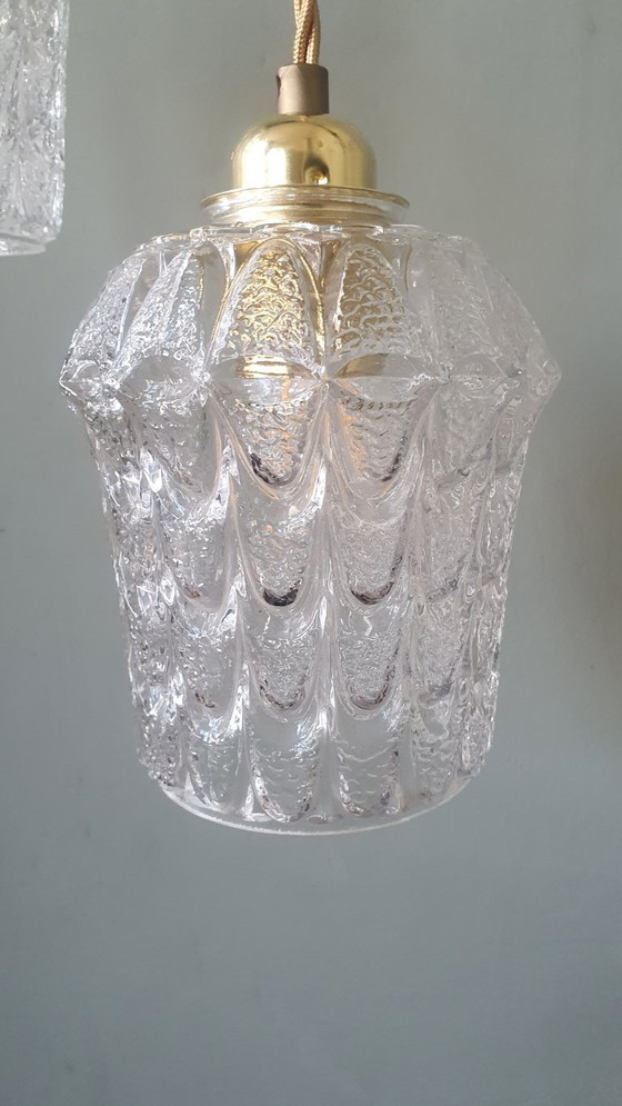 Image 1 of Set of two vintage Mic Century pendant lamps of thick, textured glass.