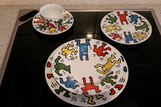 Image 1 of Keith Haring Dinnerware: 3 different sized plates, 1 coffee cup and saucer.