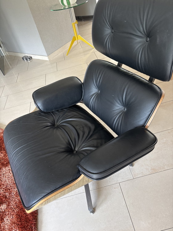 Image 1 of 2 x leather Eames armchairs with ottoman (replica)