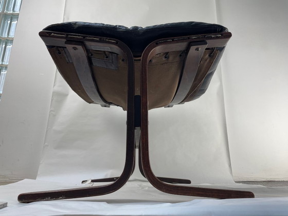 Image 1 of Siesta armchair and footrest in black leather and mahogany wood