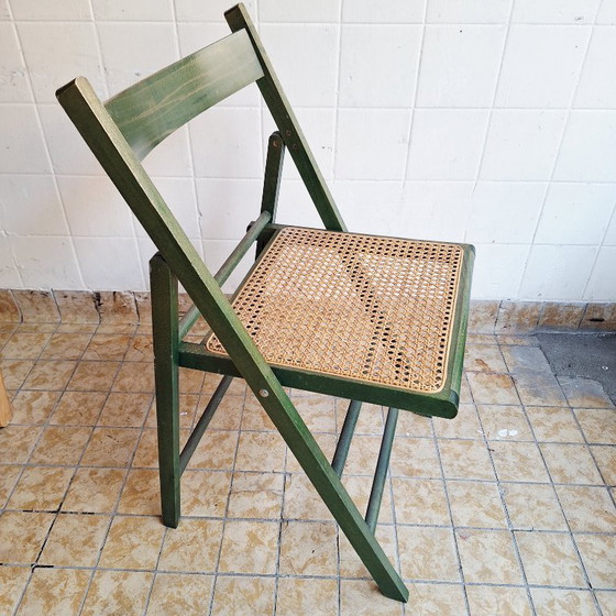 Image 1 of Sedia pieghevole vintage in legno con seduta in rattan