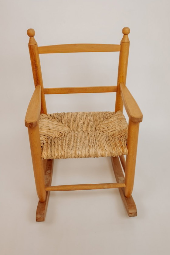 Image 1 of Vintage wooden children's rocking chair with rush seat