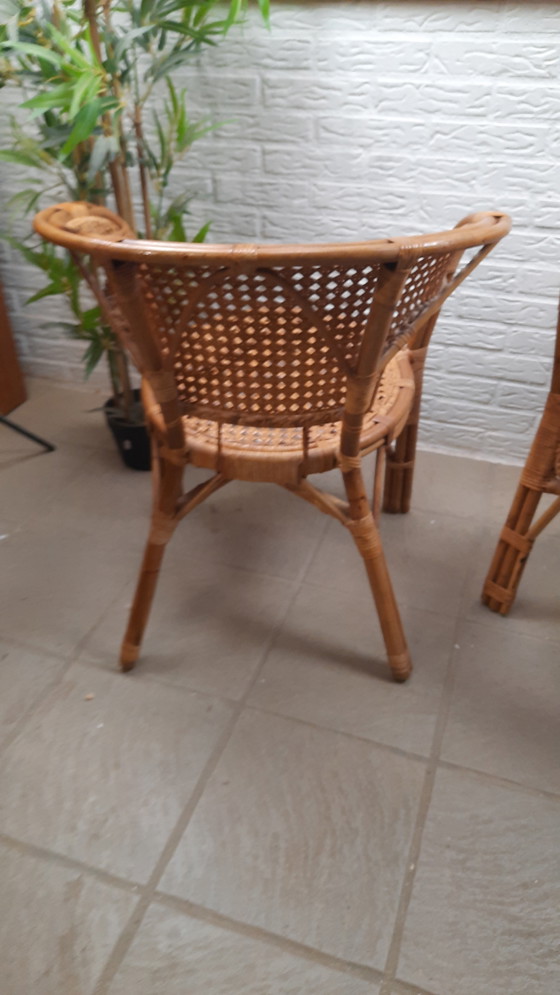 Image 1 of Set di 2 poltrone vintage in rattan con seduta e schienale intrecciati.