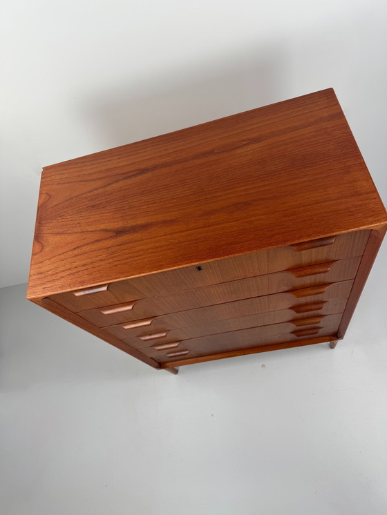 Image 1 of Scandinavian Mid-Century Teak Chest of Drawers – Elegant Sculpted Details