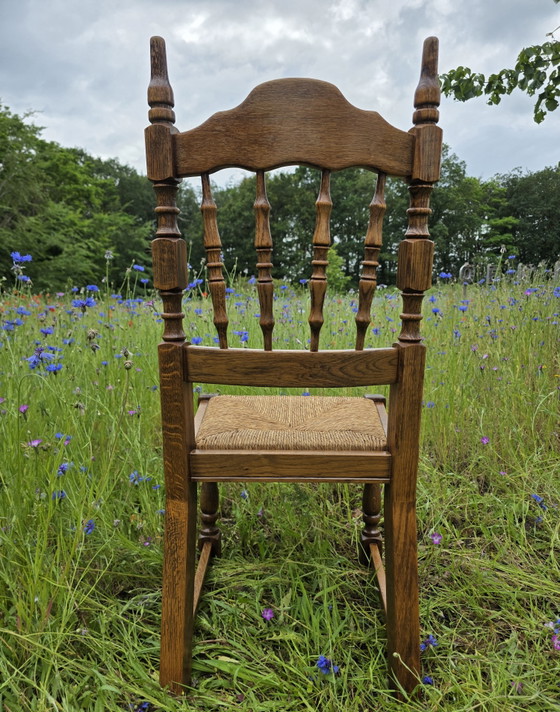 Image 1 of Set van 4 massief eiken stoelen met rieten zitting