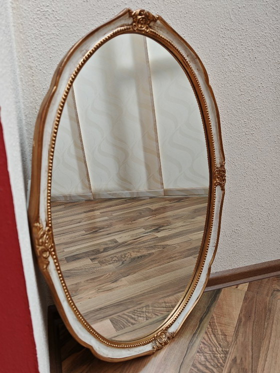 Image 1 of Oval mirror with wooden frame, white, gold from an estate