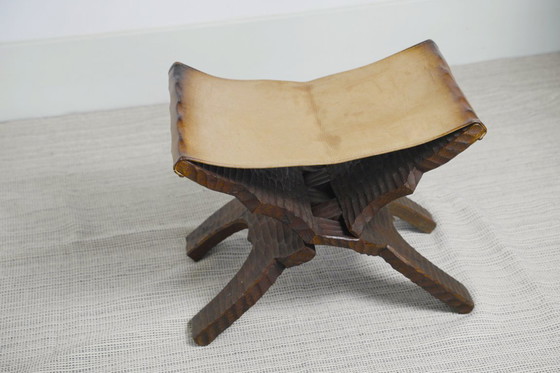 Image 1 of Brutalist Folding Stool Leather Sling Seat Hand Carved Wood X Frame 1950s Rustic Mid Century Ottoman