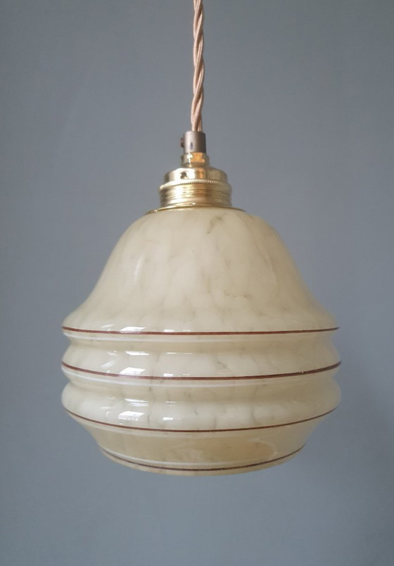 Image 1 of Vintage hanglamp - amberkleurig glas met spots en goudkleurige biezen.