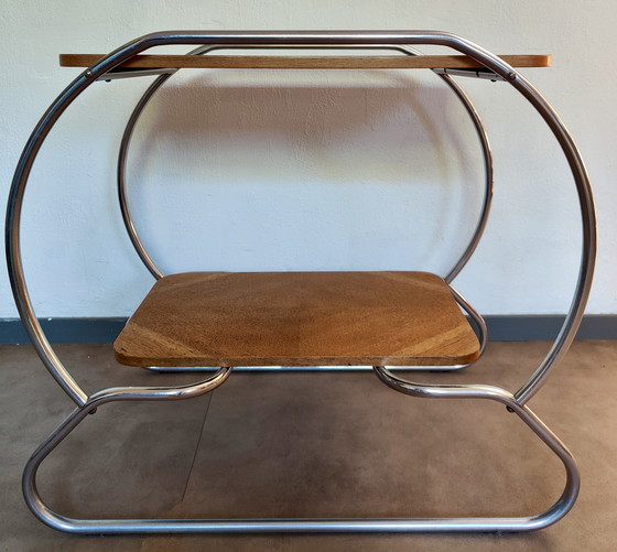 Image 1 of Mesa auxiliar Art Decó / Bauhaus - estructura tubular y tablero chapado