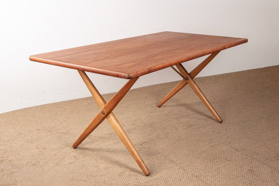 Image 1 of Deense eettafel van massief teak en beukenhout met messing, model AT 303, ontworpen door Hans Wegner voor Andreas Tuck in 1960.