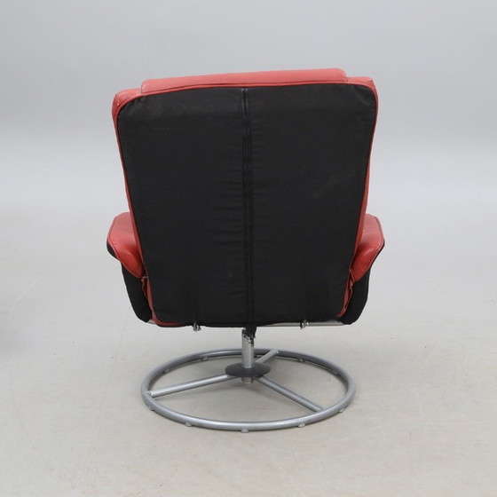 Image 1 of IKEA red leather armchair designed by K. Hagberg – M. Hagberg, from 2000–2010, with a tubular steel tripod base
