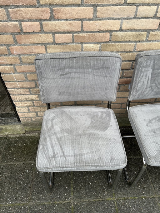 4 sillas de tela acanalada pura con estructura tubular cromada