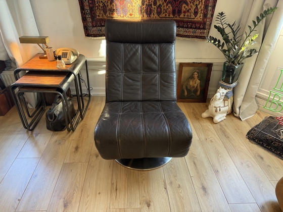 Image 1 of Dark brown vintage leather lounge armchair – timeless luxury and character