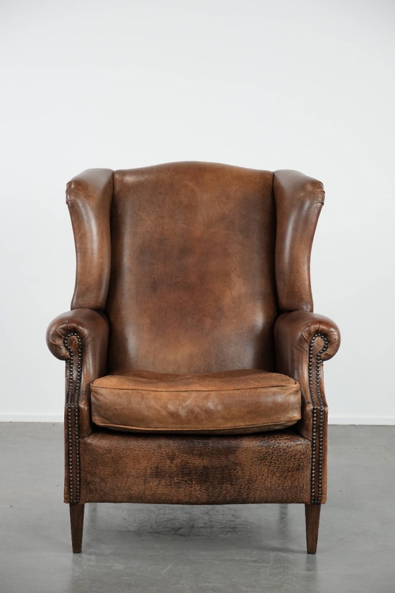 Image 1 of Comfortable vintage sheepskin wing chair with character