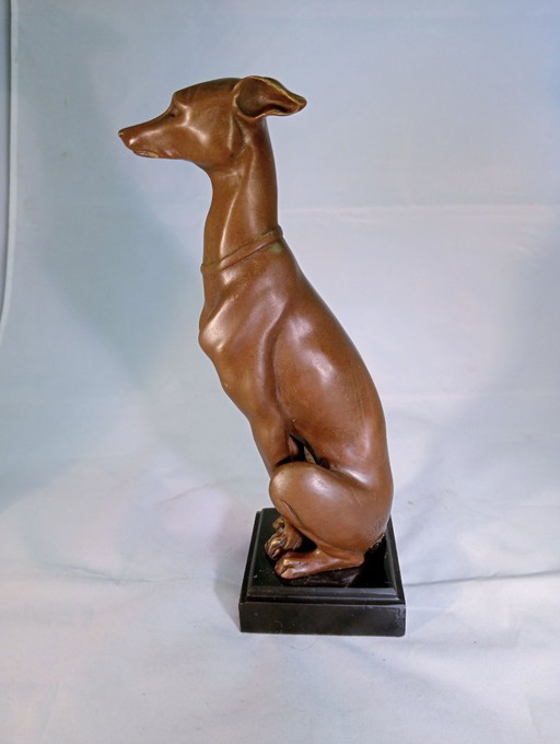 Sculpture of a greyhound, bronze colored
