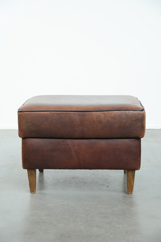 Image 1 of Vintage sheepskin stool with black piping