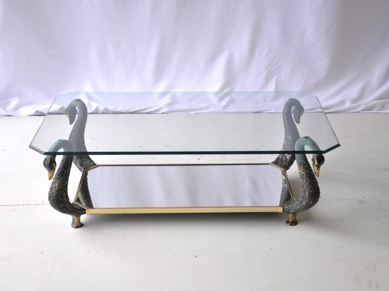 Image 1 of Vintage glazen salontafel met sculpturaal zwanenframe en glazen blad