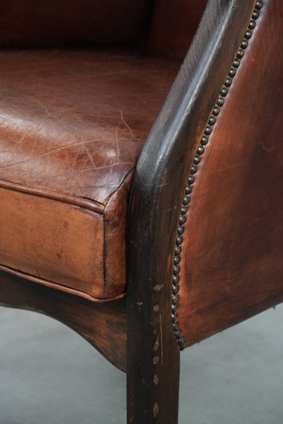 Image 1 of Fauteuil à oreilles classique vintage en peau de mouton et bois