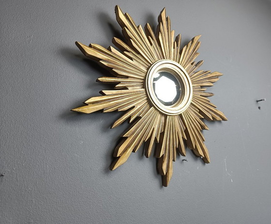 Image 1 of Beautiful resin sunburst mirror with convex mirror glass.  The golden mirror is in a good condition.  1960s - made in Belgium.  