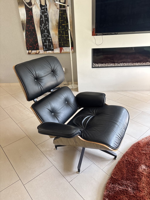 2 x leather Eames armchairs with ottoman (replica)
