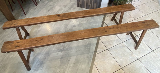 Image 1 of Twee massief eikenhouten boerenbanken van 214 cm voor een rustieke boerentafel uit de jaren 50.
