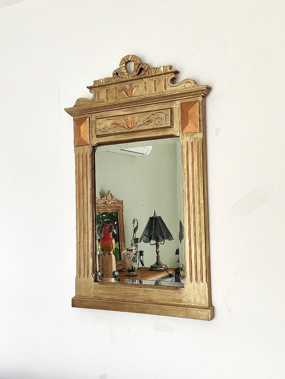 Image 1 of Gilded wooden mirror with carved pediment in the trumeau style
