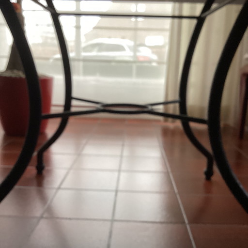 Tafelblad in Doornikse blauwe hardsteen + tafelpoot in smeedijzer