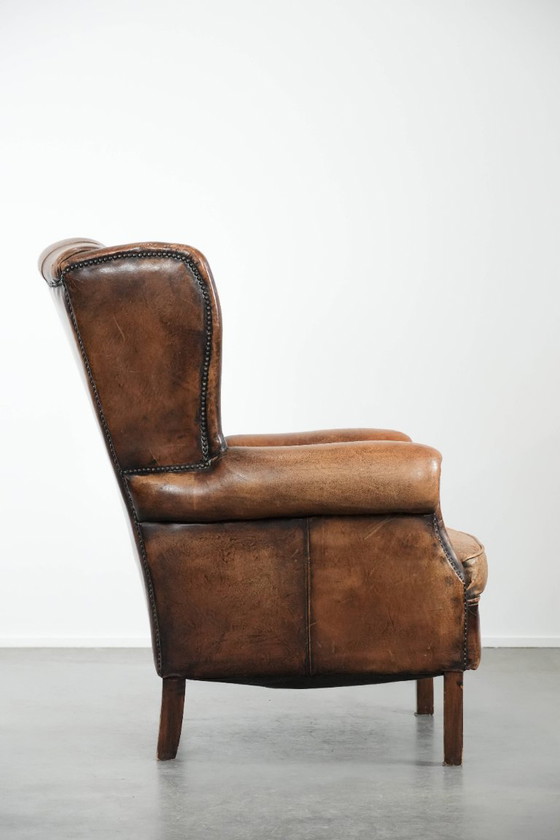Image 1 of Unique large English-style sheepskin Chesterfield wing armchair