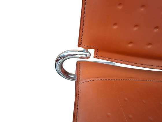 Image 1 of Set van 4 designstoelen in oranje leer en vintage ijzer.