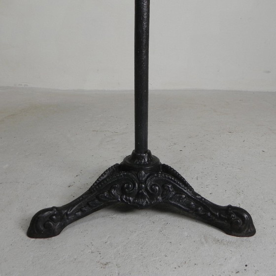 Image 1 of Bistro table with cast iron legs and round steel top, 1930s