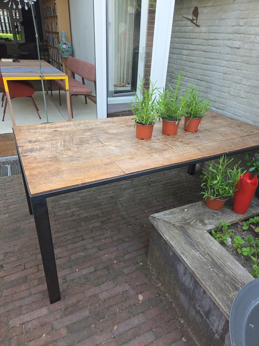 Steel table with teak top