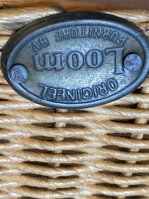 Lloyd Loom chairs, with blue fixed cushions.