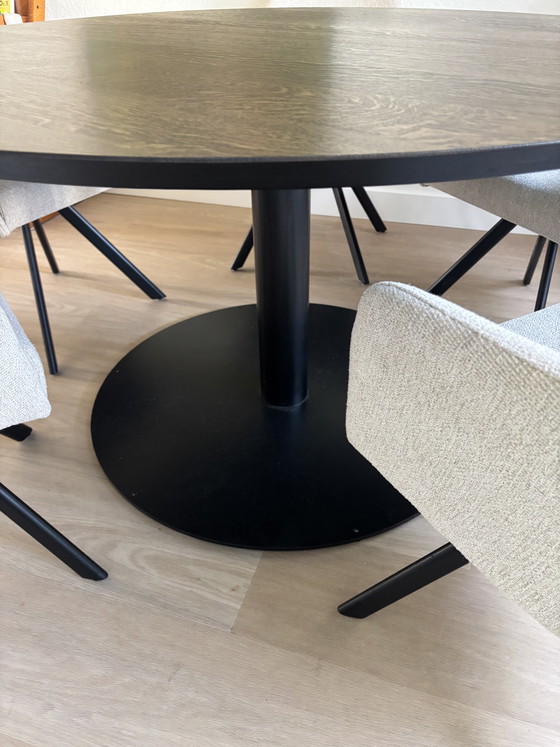 Image 1 of Solid oak dining table with steel column base.