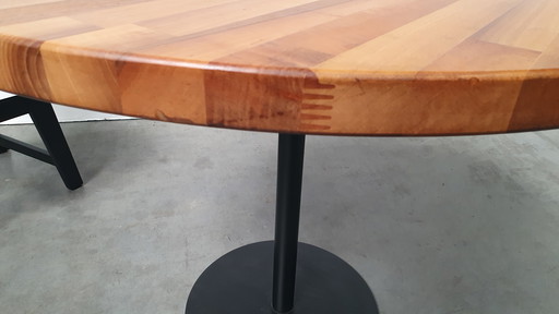 Round mixed wood table 100cm cast iron base Pedrali