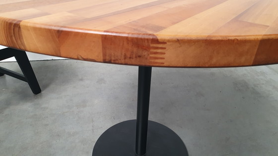 Image 1 of Round mixed wood table 100cm cast iron base Pedrali