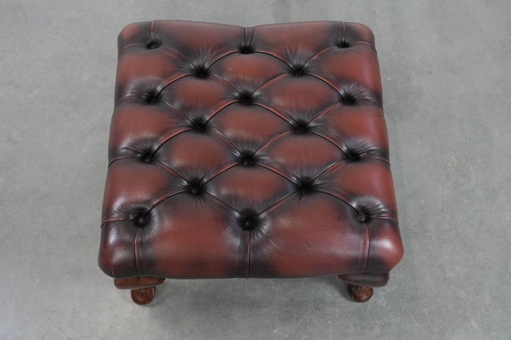 Image 1 of Dark brown Chesterfield footstool made of cowhide