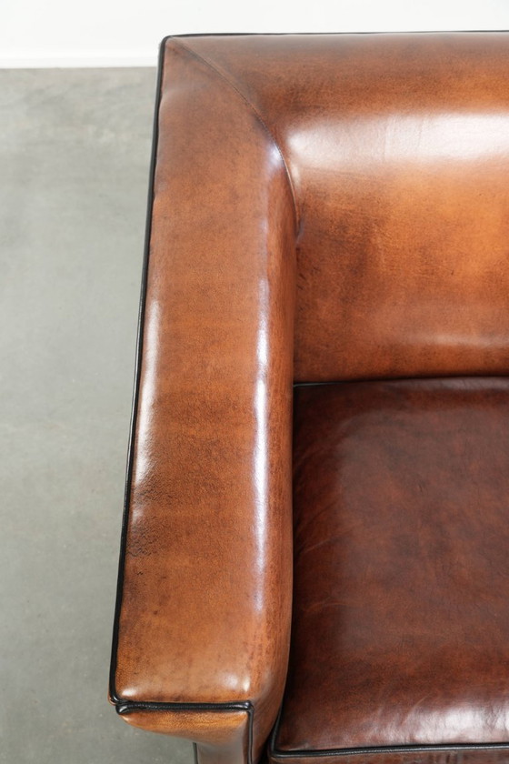 Image 1 of Sheepskin Art Deco design armchair with black piping