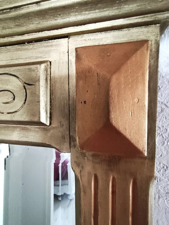 Image 1 of Gilded wooden mirror with carved pediment in the trumeau style