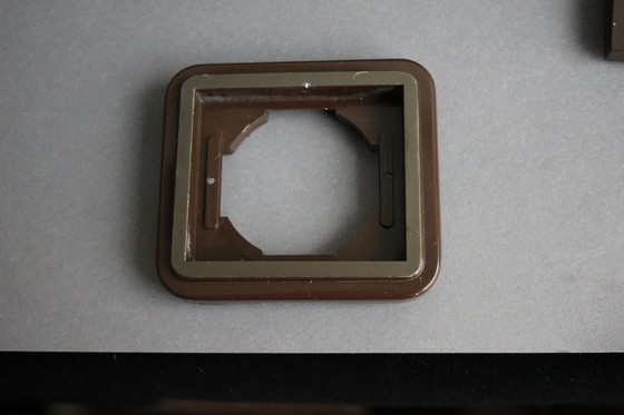 Image 1 of Large collection of vintage brown light and socket switches from the 1970s, brand BLASS.