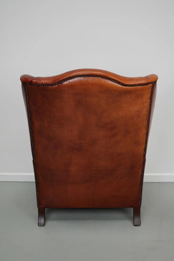 Image 1 of Vintage Nederlandse cognackleurige leren clubfauteuil met vleugelrug