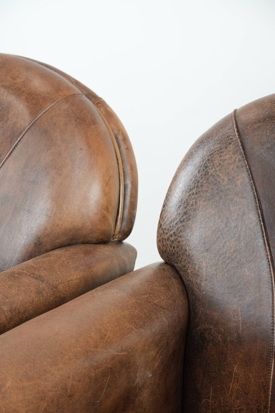 Image 1 of 2 x Vintage sheepskin armchair with warm colours and a characterful appearance