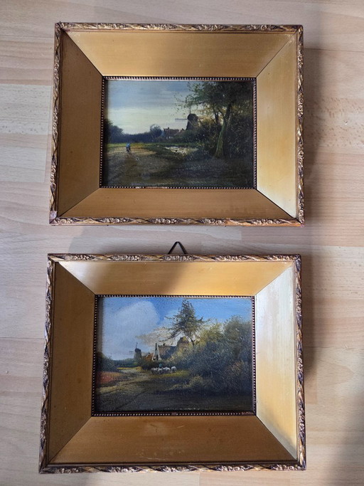 Dos pinturas de paisajes en marco dorado