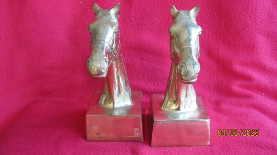 Image 1 of Sujetalibros de bronce dorado