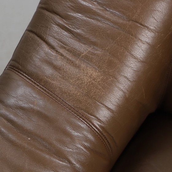 Image 1 of Pair of mid‑century brown leather club armchairs in good condition with small signs of aging and blemishes