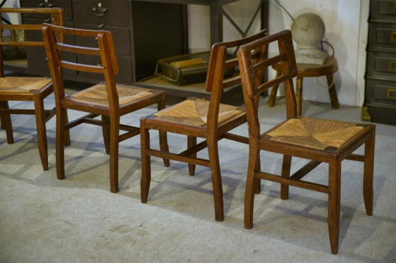 Image 1 of Set van 6 eikenhouten stoelen in de stijl van Pierre Cruège, jaren 1940.