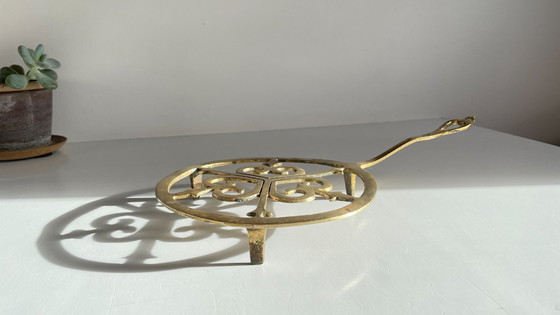 Image 1 of Solid brass trivet