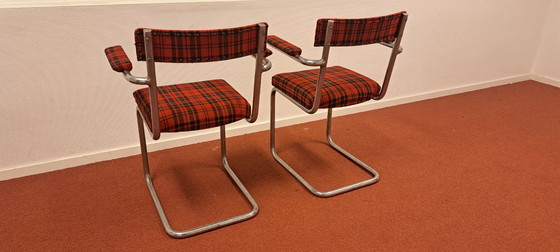 Image 1 of Ensemble de 2 chaises tubulaires avec accoudoirs | style rétro | rouge