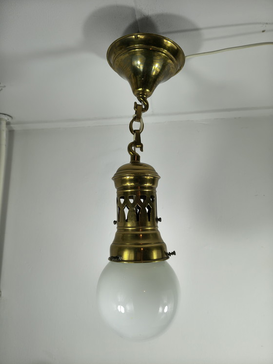 Image 1 of Ciondolo in ottone con sfera in vetro opalino