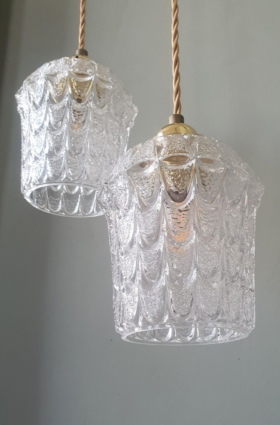 Image 1 of Set of two vintage Mic Century pendant lamps of thick, textured glass.