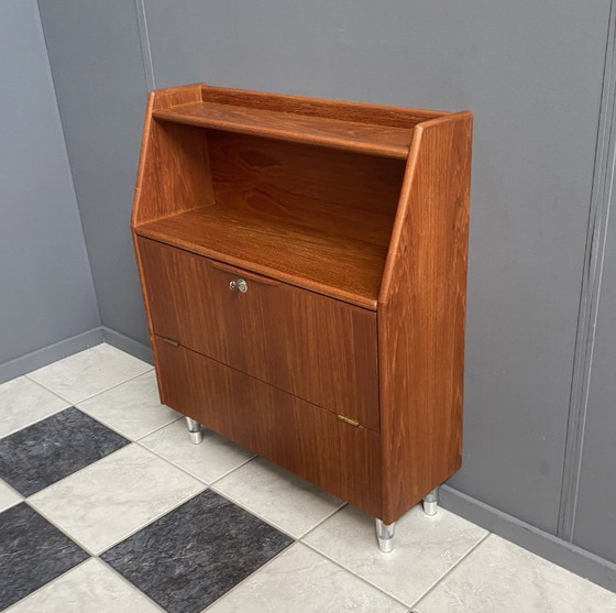 Image 1 of Teak tall sideboard on lucite legs 1960s